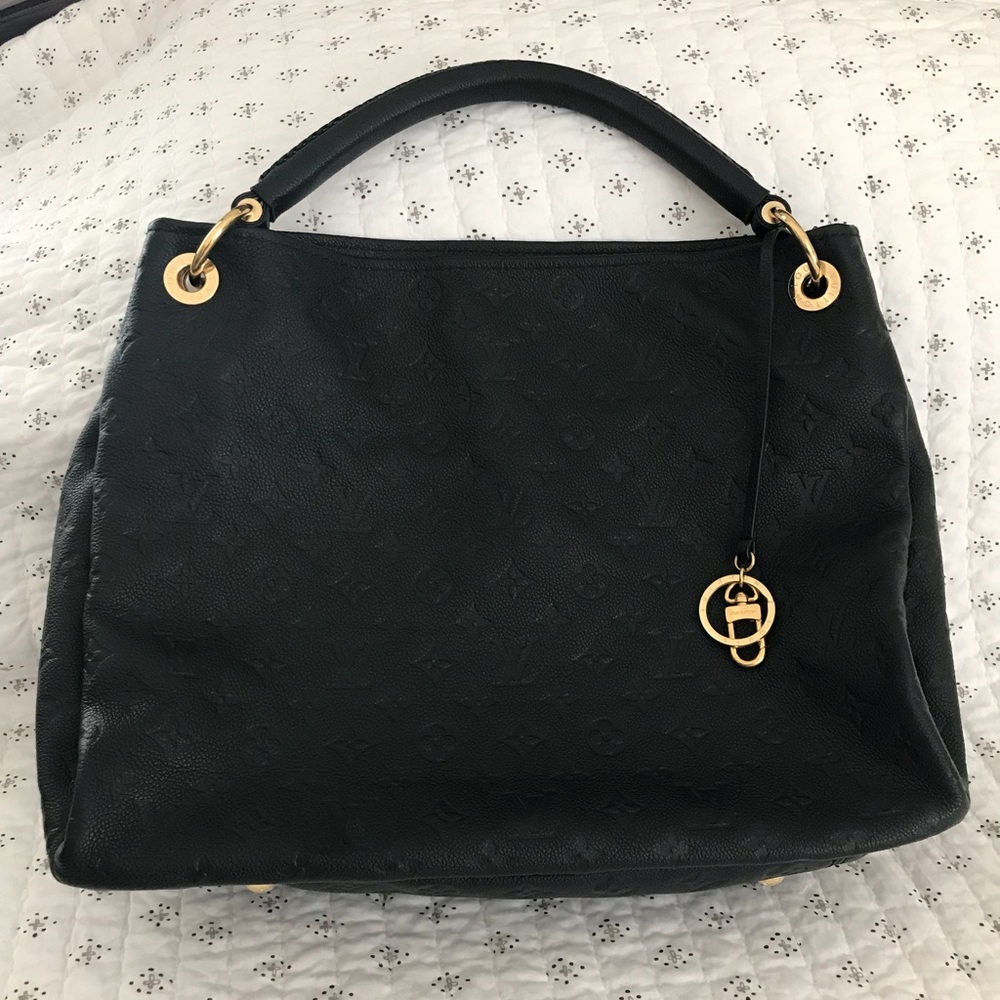Louis Vuitton Black imprinted monogram bag. Shiny!